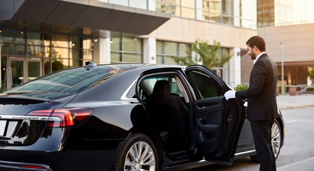Executive Sedan luxury chauffeur car service card showing capacity for up to 3 passengers, 3 luggage bags, ideal for solo travelers, couples, and business trips.